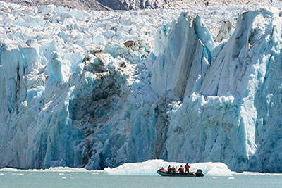 Alaska cruise small ship Passengers enjoying a glacier activity